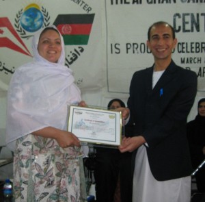 Ehsan awards a certificate of achievement