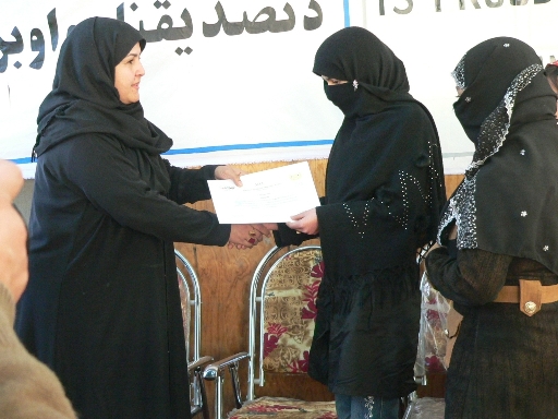Ronal Tarin member of Afg. Upper House presenting students certificates