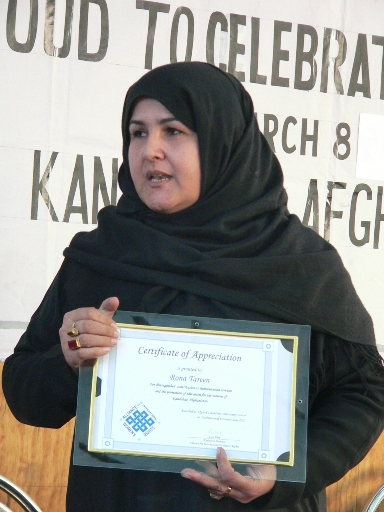 Snator Rona Tarin showing appreciation certificate prepared for her by IWRA