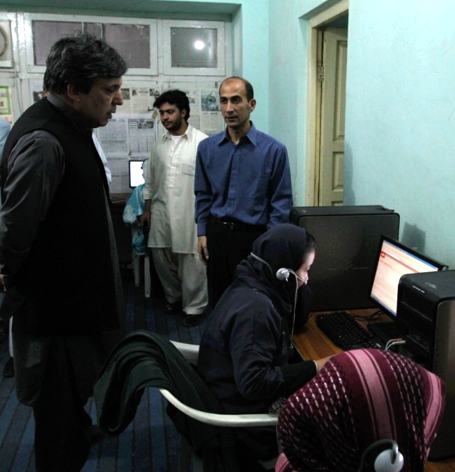 Mr. Karzai watches a student study online with SAIT
